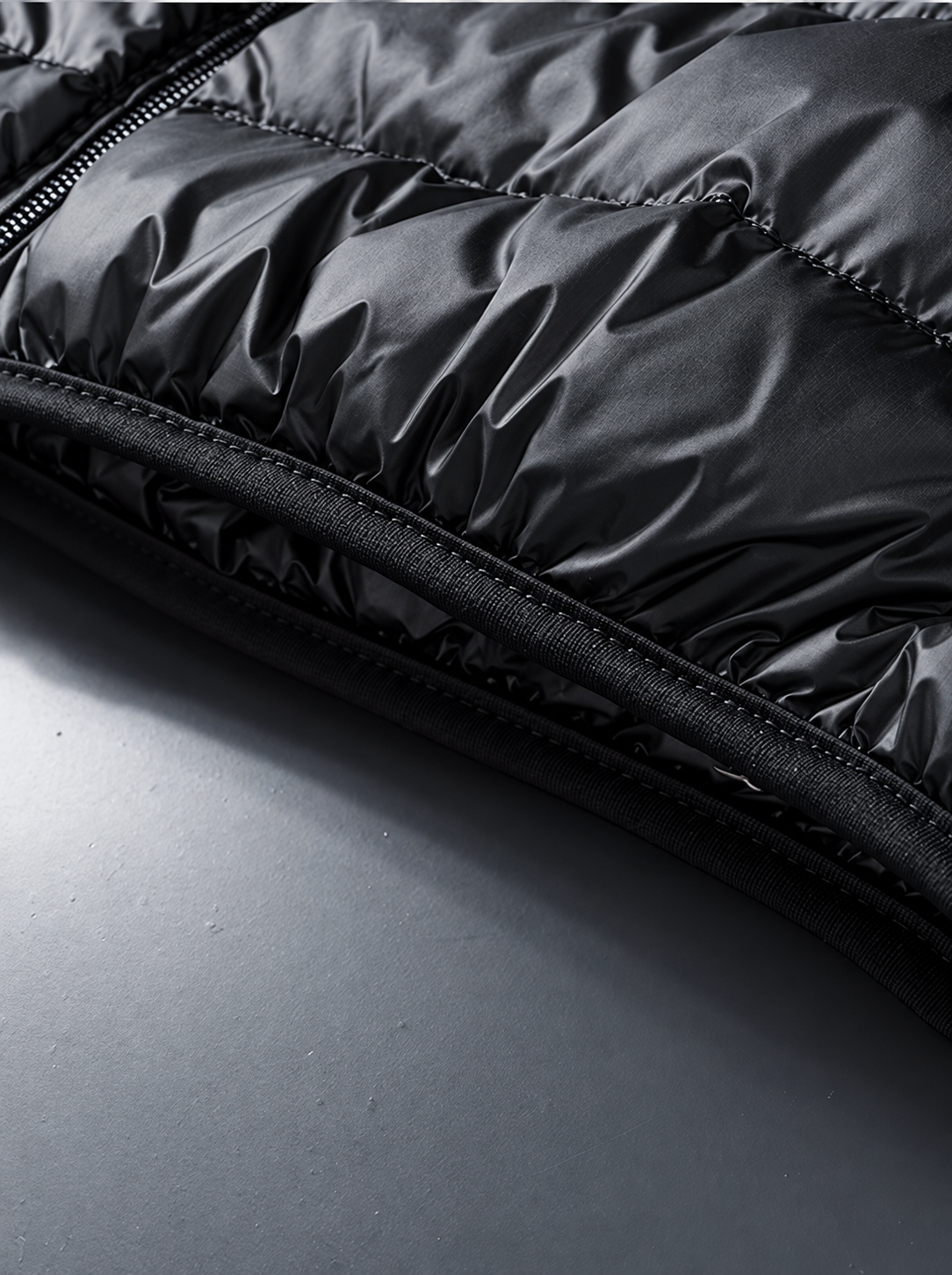 Ravellu quilted stand collar jacket — Quilted hem detail